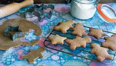 some cookies and cookie cutters on a table