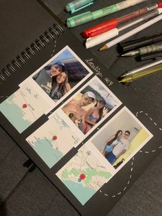 some pens and markers are laying on top of an open notebook with photos in it