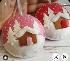 two handmade christmas ornaments are shown on a white wooden table with pink polka dots