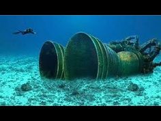 an underwater camera is shown in front of a large pipe on the bottom of the ocean floor