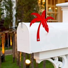 a white mailbox with a red bow on it