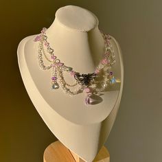 ✧*̥˚ 𝑀𝑜𝓅𝒽𝒶 𝐿𝒾𝓁𝒶 *̥˚✧ Layered with silver chain, this intricate necklace is handmade with purple and clear crystal beads, delicate water drop beads, and a silver moth charm. Accented with mini purple butterflies and chains of crystal beads, the elements of this piece balance each other in complexity and elegance, making the "Mopha Lila" necklace a perfect statement piece for any special occasion! ੈ♡˳ Handmade with love and attention ੈ♡˳ Delicate selection of beads and charms, carefully a Silver Fairycore Crystal Necklaces For Jewelry Making, Silver Beaded Teardrop Crystal Necklace, Beaded Drop Crystal Necklaces As Gift, Crystal Necklaces With Silver Beads For Jewelry Making, Crystal Necklaces With Silver Beads As Gift, Crystal Necklaces With Silver Beads For Gift, Silver Pendant Crystal Necklace With Beaded Chain, Crystal Beaded Necklaces With Dangling Beads For Gifts, Silver Crystal Necklaces With Dangling Beads As Gift