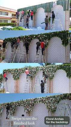 people are climbing up the side of a building with flowers on it and ladders