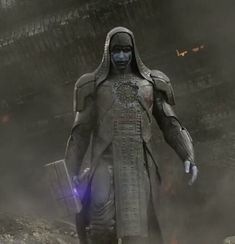 a man dressed in armor walking through the dust