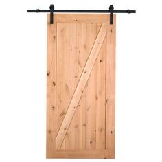 an open wooden door with black metal handles