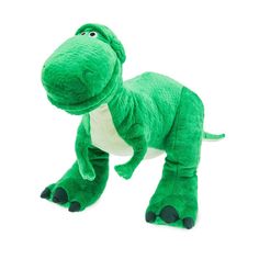 a green dinosaur stuffed animal on a white background