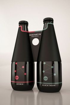 two black bottles with different designs on them