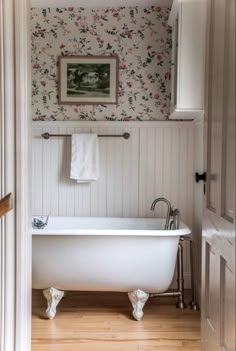 a bath tub sitting in the middle of a bathroom