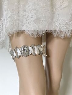 Variety of rhinestones and satin ribbons bring dimension and luxurious shimmer to this handmade jewellery wedding garter ASTRAEA. Details:- polyester satin ribbons - ivory colour, white and blue optional ribbons colours- rhinestone jewellery connector, 3.7 cm (1.5 in) width, 17.5 cm (6.9 in) length- partly hand washPlease measure your thigh 5-6 in above the knee and select the corresponding size from the list of options. Any irregularities in fabric, beading or embroidery are the result of the c Personalized Wedding Garter, Crystal Garter, Bridal Bolero Jacket, Wedding Corset, Wedding Garter Lace, Veil Headpiece, Bridal Cover Up, Jewellery Wedding, Wedding Garters