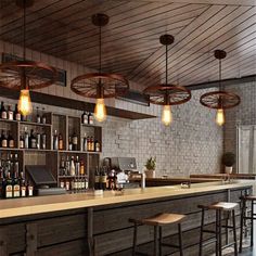 a bar with stools and lights hanging from the ceiling