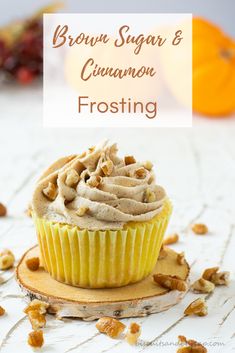 a close up of a cupcake with frosting and walnuts on a plate