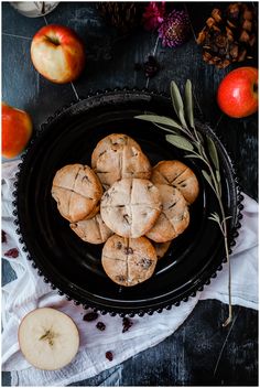 some cookies are on a black plate with an apple in the background and text overlay reads soul cakes simple recipe make these cakes for samhans or all - solid - day