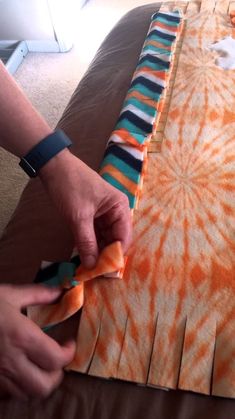 someone is making a tie - dyed piece of fabric