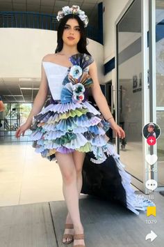 a woman in a dress made out of paper