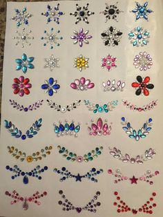 a sheet of stickers with different designs on it, including flowers and leaves in various colors