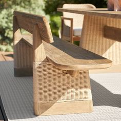 a wooden bench sitting on top of a patio