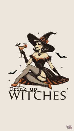 a woman dressed as a witch sitting on the ground with a glass in her hand