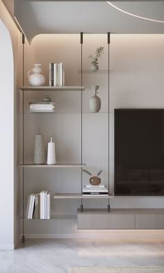 an entertainment center with shelves, vases and a flat screen tv on the wall