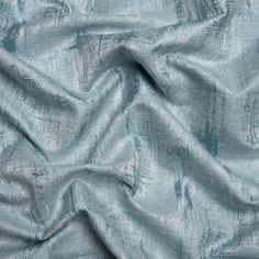 This British Imported Mid Seaspray Abstract Distressed Drapery Jacquard effortlessly orchestrates an allure of opulence. The marriage of texture irregularities and subtle discoloration gracefully crafts a distressed appearance across its sophisticated aqua and pale blue face. The intricate, dimensional weave of the Jacquard promises an elegant touch, while its malleable drape and lustrous face elevate the ambiance of any room. Whether drawing your eyes upward with long, pooling drapes, infusing Printed Linen Fabric, Tencel Fabric, Silk Tulle, Wool Quilts, Mood Fabrics, Border Print, Formal Dining, Silk Charmeuse, Apparel Fabric