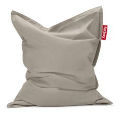 a grey pillow with a red tag on the front and back of it's cover