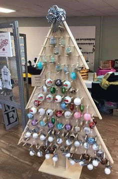 a christmas tree made out of glass balls and wooden sticks is shown on the facebook page