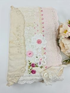 an old lace pillow with flowers on it