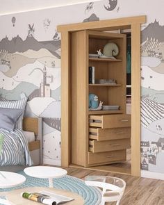 a room with a bed, table and shelves in it next to a wall mural