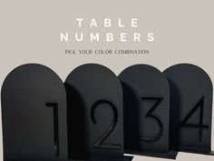 the numbers are placed next to each other in front of black mailboxes that read, table numbers pick your color combination