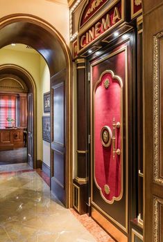 the entrance to a building with red doors