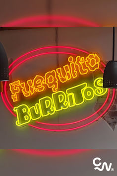 a neon sign hanging from the side of a wall next to lamps and light bulbs