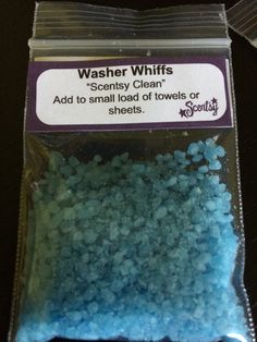 a bag of blue and white powdered washers on top of a black table