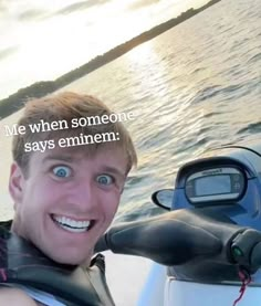 a man riding on top of a boat with the caption'me when someone says emiimen '