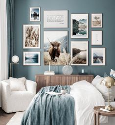 a bedroom with blue walls and pictures on the wall