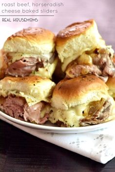 a white plate topped with sandwiches on top of a table