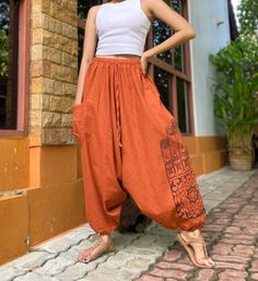 "The harem style trousers made from cotton fabric 100%with an elasticated smock waist and ankles they provide a comfortable lightweight fit, perfect for casual wear, festivals, yoga, holidays as well as pairing with a plain top to get that popular look. D I S C O U N T & P R O M O T I O N ❤ Buy 2 or more items, get 10% off ❤ Buy 4 or more items, get 15% off ENTER the coupon code: IYARA015 ❤ Buy 6 or more items, get 15% off ENTER the coupon code: IYARA020 PLEASE NOTE I can not apply a discount af Harem Pants Outfit, Monkey Character, Pantalon Orange, Nomad Fashion, Pinterest Wardrobe, Squirrel Monkey, Bohemian Pants, Orange Pants, Festival Pants