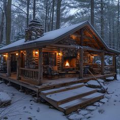 a cabin in the woods with snow on the ground and steps leading up to it