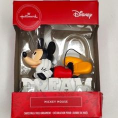 the mickey mouse ornament is in its box