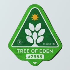 a tree of eden sticker sitting on top of a white surface