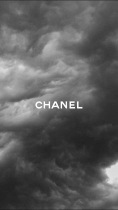 black and white photograph of clouds with the word chanel on it