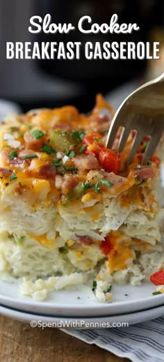 a white plate topped with lasagna casserole and a fork