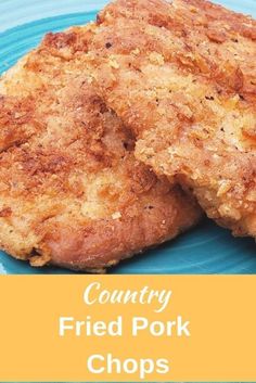 two fried pork chops on a blue plate with the title country fried pork chops