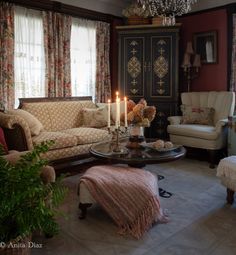 a living room filled with furniture and a chandelier