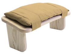 a wooden bench with a cushion on it