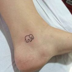 small elephant tattoo on the foot