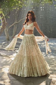 Spark a unique grace to your personality by donning this outstanding cream color lehenga made of georgette material embellished with sequins embroidered work. Lehenga fabric details Lehenga(Stitched) Lehenga Fabric : Georgette Lehenga Work : Sequins Embroidery Work Waist : Supported up to 42 Stitching : Stitched With Canvas Lehenga Closer : Drawstring with Heavy Tassels Length : 41 Flair : 3.50 Meter Dupatta Dupatta Fabric : Georgette Dupatta Work : Sequins Embroidery Work with Cutwork Lace bord Tiered Lehenga, White Lehenga Choli, Seema Gujral, Royalty Dress, Lehenga Choli Designs, Lehenga Choli For Women, Choli For Women