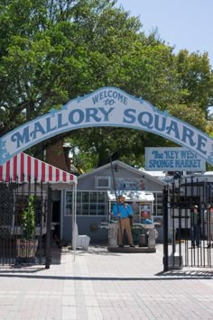 the entrance to mallory square is open and has an awning over it