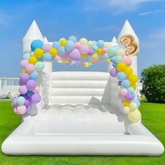 an inflatable arch decorated with balloons