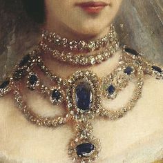 a portrait of a woman wearing an elaborate necklace and tiara with blue stones on it