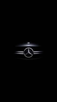 the mercedes logo is illuminated in the dark