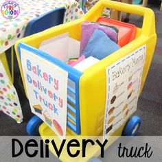 a child's toy shopping cart filled with books and other children's toys